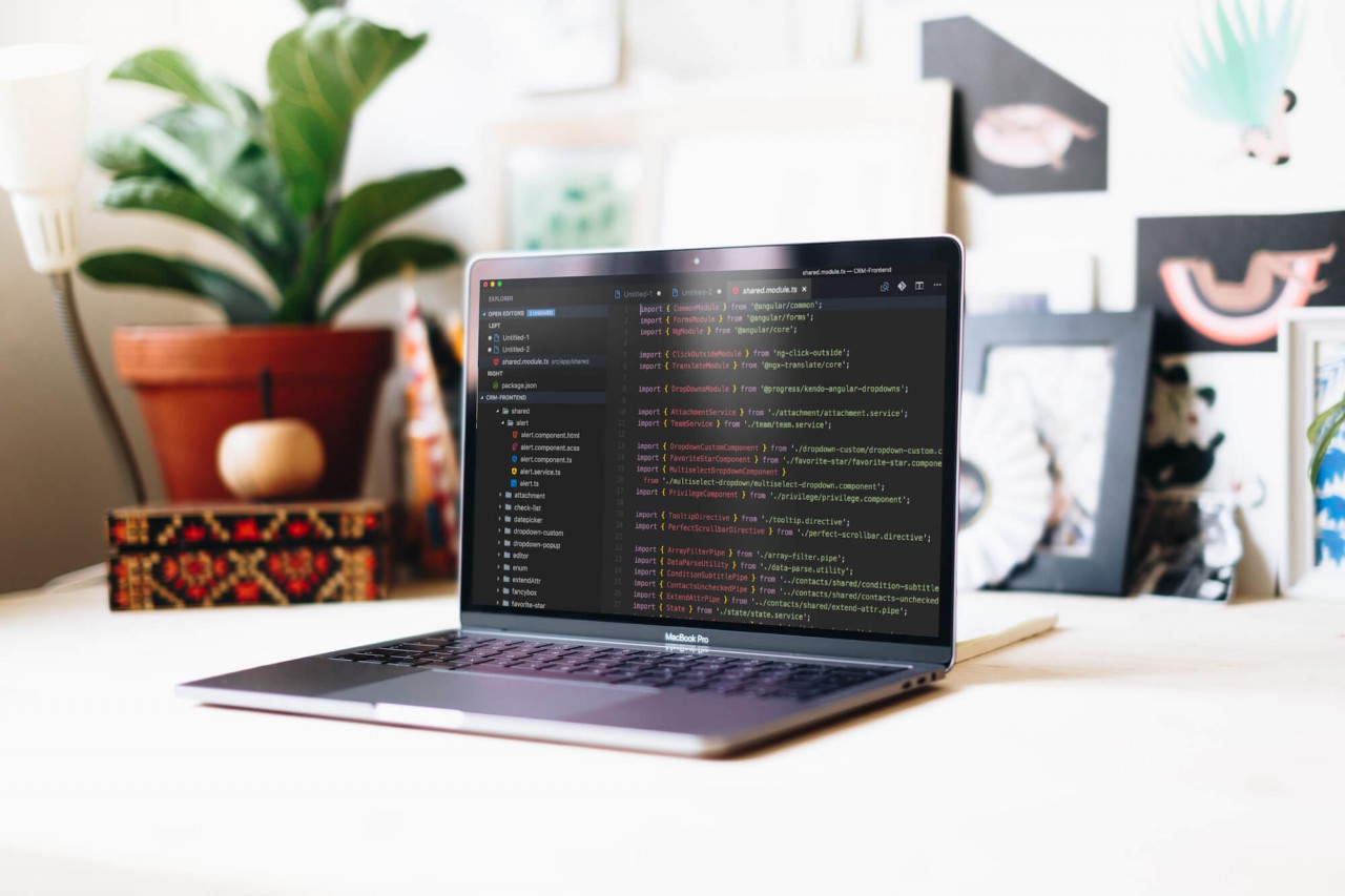 side-view-of-macbook-pro-mockup-in-a-creative-workspace