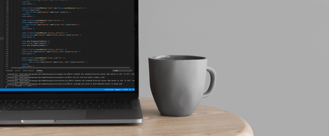mockuuups-cropped-view-of-macbook-pro-mockup-on-wooden-table